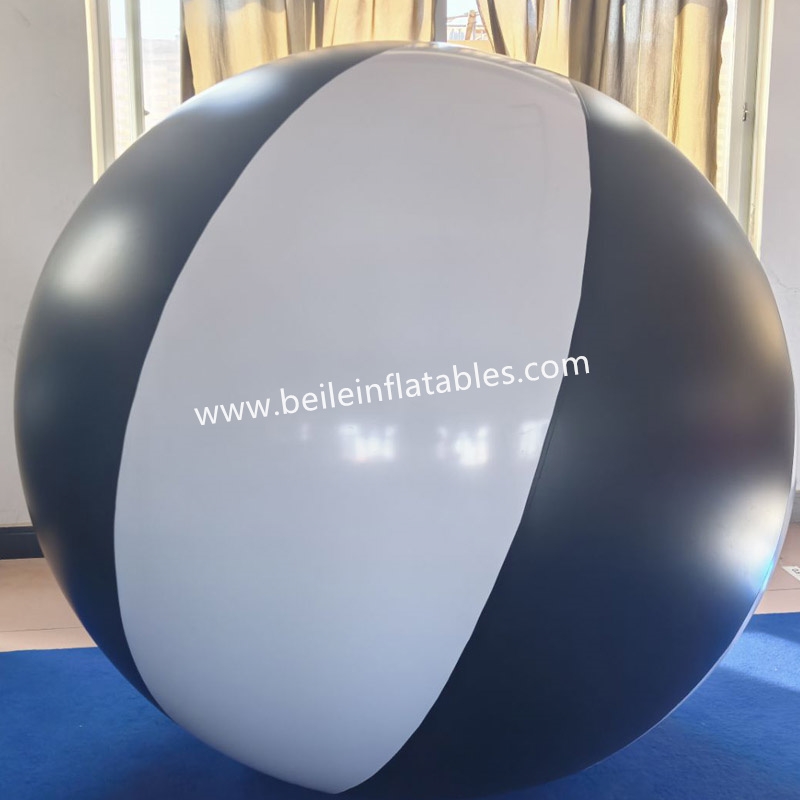 Inflatable black and white ball suit with black coat